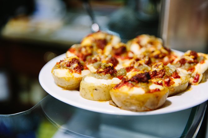 Barcelona Night Bike Tour with Local Tapas and Cava Stop - Casa Golferichs and Palau de la Música: façades worth your stop-time