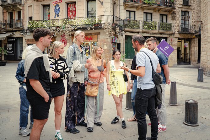 Barcelona Old City Guided Tour with Tapas and Drinks - El Born at night: candlelit bars, porron pour, and family-style plates