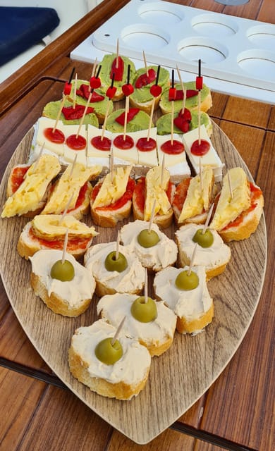 Barcelona: Sailing Tour with Spanish Tapas and Drinks - Tapas onboard: what you actually get and how to eat well