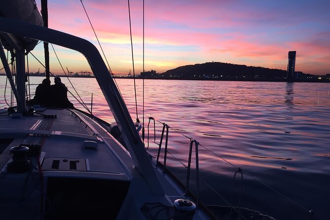 Barcelona: Sailing Tour with Tapas, Drinks, Swim & Sunset Option - The two-hour plan: safety talk, coastline cruising, and shared food