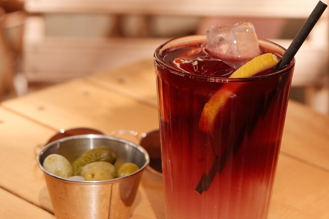 Eating Seville: Tapas, Drinks and Local Flavors Tour - Bodega La Aurora: flambé chorizo al infierno and tinto de verano