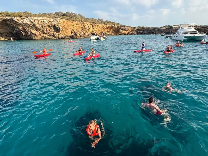 Ibiza: Sunset Boat Tour with Water Sports, Open Bar & Tapas - Cruise Time on Ibiza’s Northwest: Cliffs, Caves, and Cove Views
