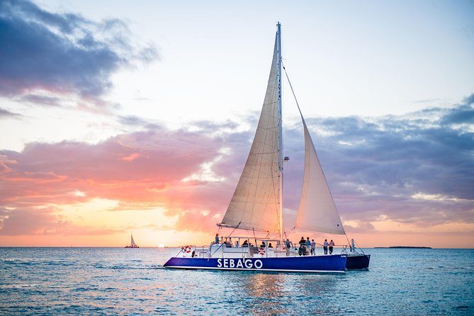 Key West Sunset Sail: Dolphin Watching, Wine, and Tapas - The Route Past Key West Landmarks: Mallory Square to Sunset Key Views