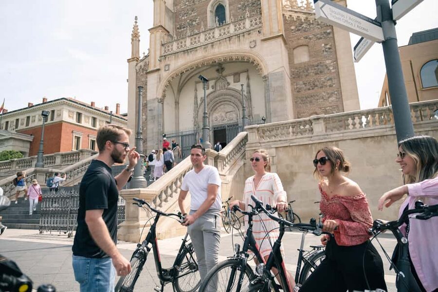 Madrid: 3 h. Guided Highlights Bike Tour with Optional Tapas - Almudena Cathedral and Plaza de la Villa: Where Madrid Gets Older