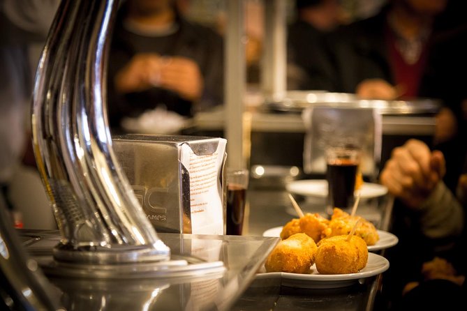 Madrid Local's Tapas Tour Dinner with a side of History - Calle de Preciados croquettes: the 1860 tavern stop