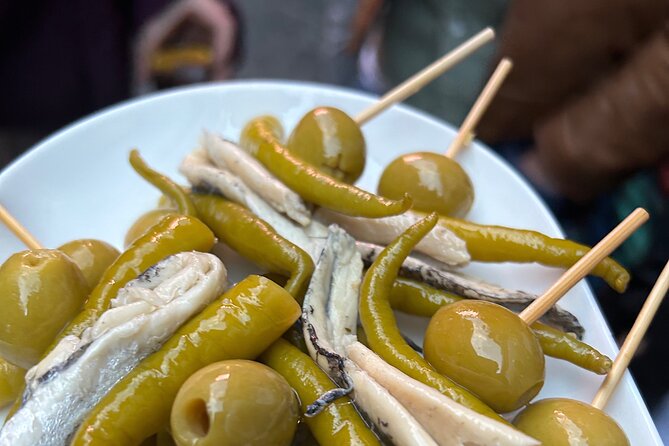 Madrid Local Tapas Tour with Private Dinner and Bottomless Wine - Entering Calle de Atocha 76: where the evening starts