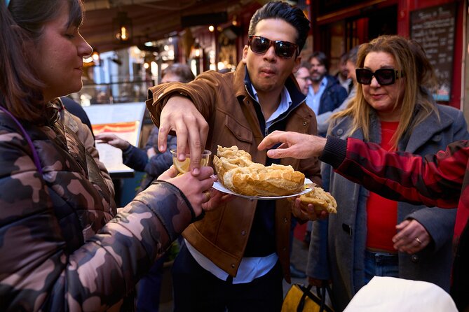 Madrid: Not Just Another Tapas & Wine Tour by Eating Europe - The food highlights: calamari sandwich, paella twist, and sweet finish