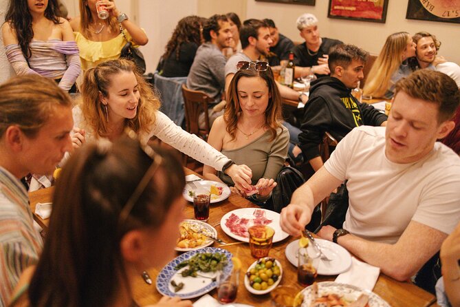 Madrid: Private Tapas & Wine Food Walking Tour in La Latina - Calle de Toledo: the squid-ink sandwich and sweet wine pairing