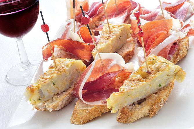 Madrid Tapas Experience Walking Tour - Plaza Mayor to Huertas: the pacing and meeting point
