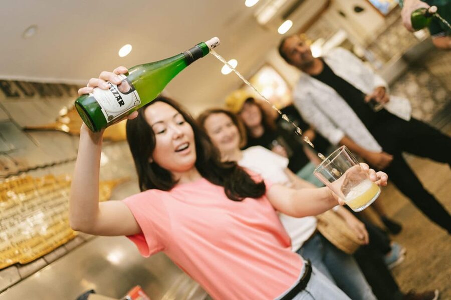 Madrid: Tapas, Taverns & History Tour - El Escarpín and Asturias cider: tasting with your hands, not just your fork