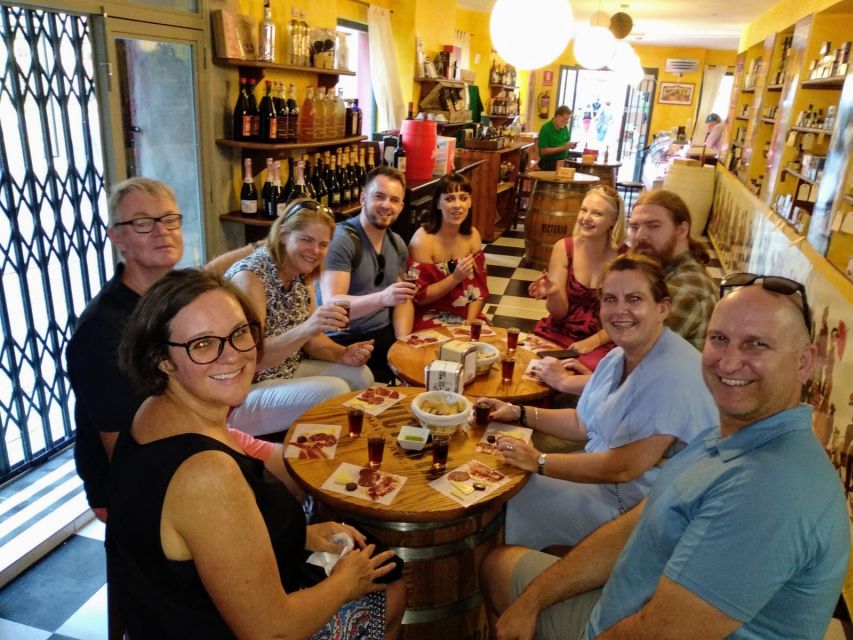 Málaga: Wine & Tapas Tour - Family-Run Grocery for Iberian Ham and Olive Oil Moments