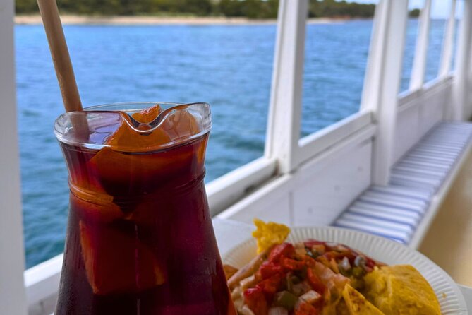 Morning Boat Trip in Alcudia with Swim Stop & Tapas - The swim stop by sea: snorkel, paddleboard, and churros