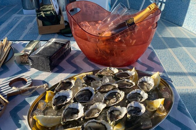 Olhão: Private Boat Tour, at Sunset with Oysters/Tapas and Drinks - Faro and the lagoon stretches: ending with the right kind of glow