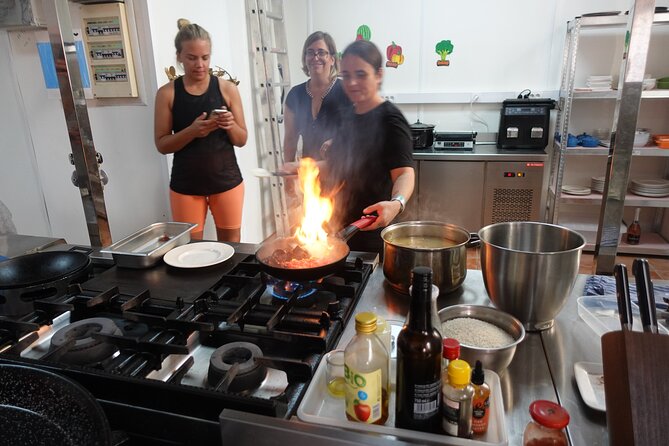 Paella & Sangria Class with Tapas and Market Visit - Cooking authentic paella: rice-first flavor logic (and why that’s good)
