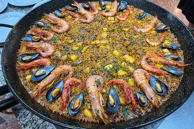 Seafood paella cooking class, tapas and visit to Ruzafa market. - Classic seafood paella, taught like a process