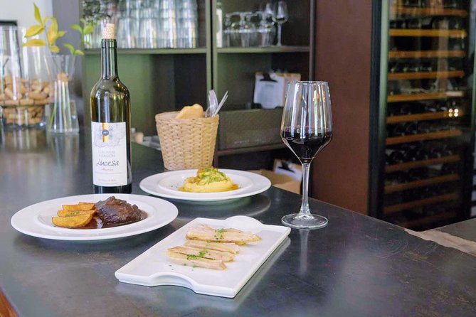 Sevilla Food Tour: Tapas, Wine, History & Traditions - Santa Cruz: patio dining in the Jewish quarter with albóndigas and PX