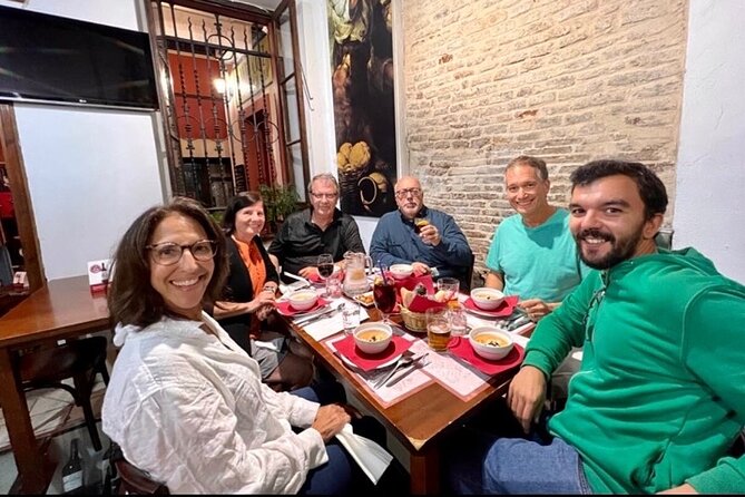 Seville Jewish Quarter Small Group Tour with Tapas and Drinks - Fortifications, the cemetery structure, and layers of worship