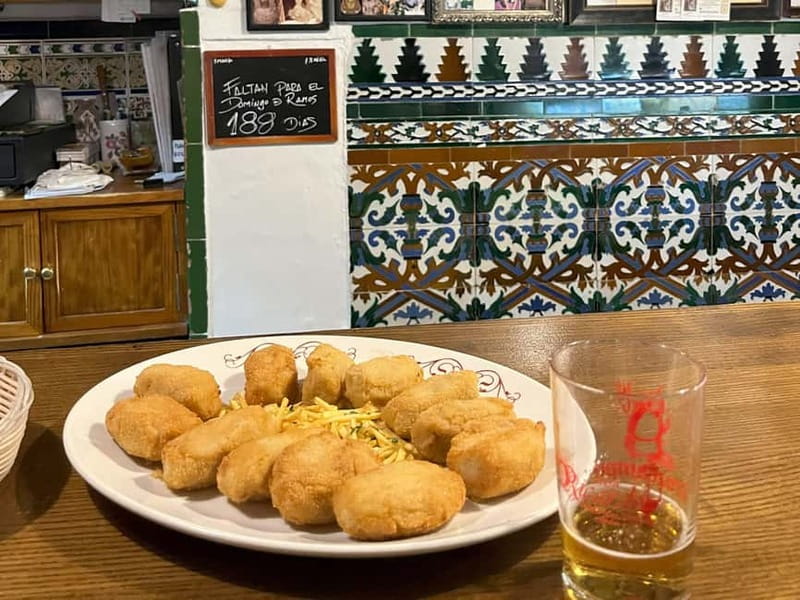 Seville: Secret Food Tour with Tapas and Drinks - Triana Market: your first real taste of the city’s food logic