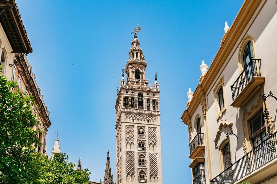 Seville: Tapas, Taverns and History Guided Walking Tour - Stop One: the oldest Jewish Quarter bar vibe with potato salad, Iberian ham, and vermouth
