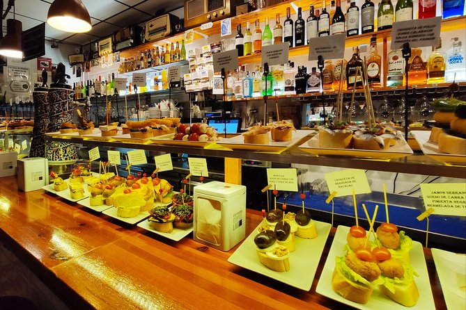Spanish Wine and Tapas Tour in a Local Neighborhood in Barcelona - Wine-and-tapas pairing across regions of Spain