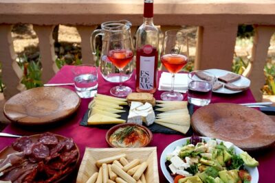 Tapas in the vineyards - Stop 2: Bodega Vera de Estenas tapas table with bottle of wine