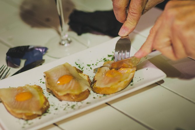 Triana Gourmet Tapas Tour in Seville - The Guadalquivir stops: bridge views, the Golden Tower, and river walks