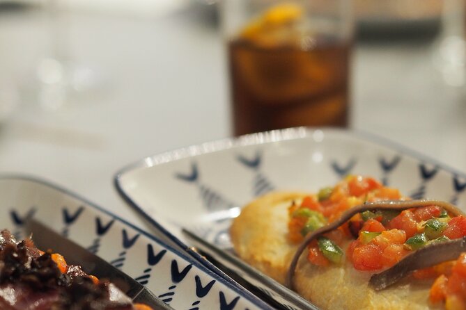 Valencia Tapas Crawl by Food Lover Tour - The food spread: tortilla, cured ham, cheeses, seafood, and more
