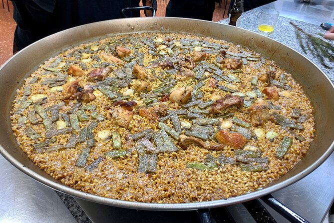 Valencian paella cooking class, tapas and visit to Ruzafa market. - Tapas, sangria-making, and the kitchen transition after the market